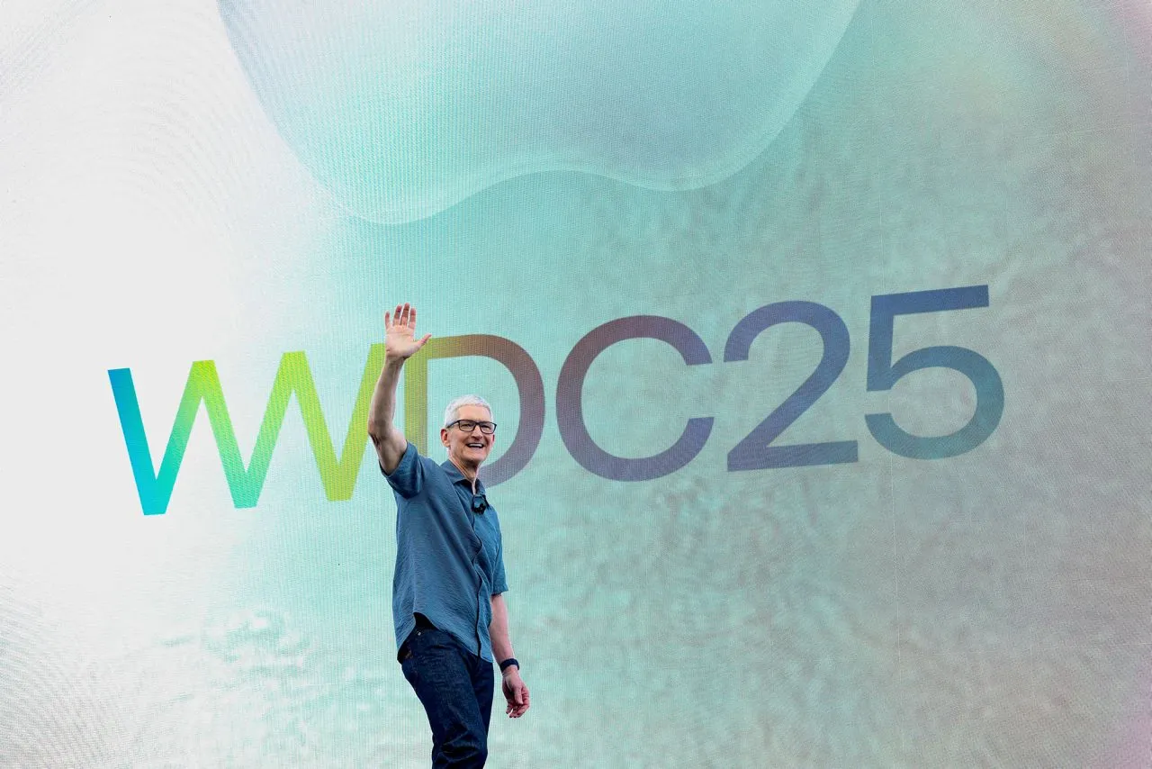 Apple CEO Tim Cook greets the audience with a wave during the company’s annual Worldwide Developers Conference held today at its headquarters in Cupertino, California