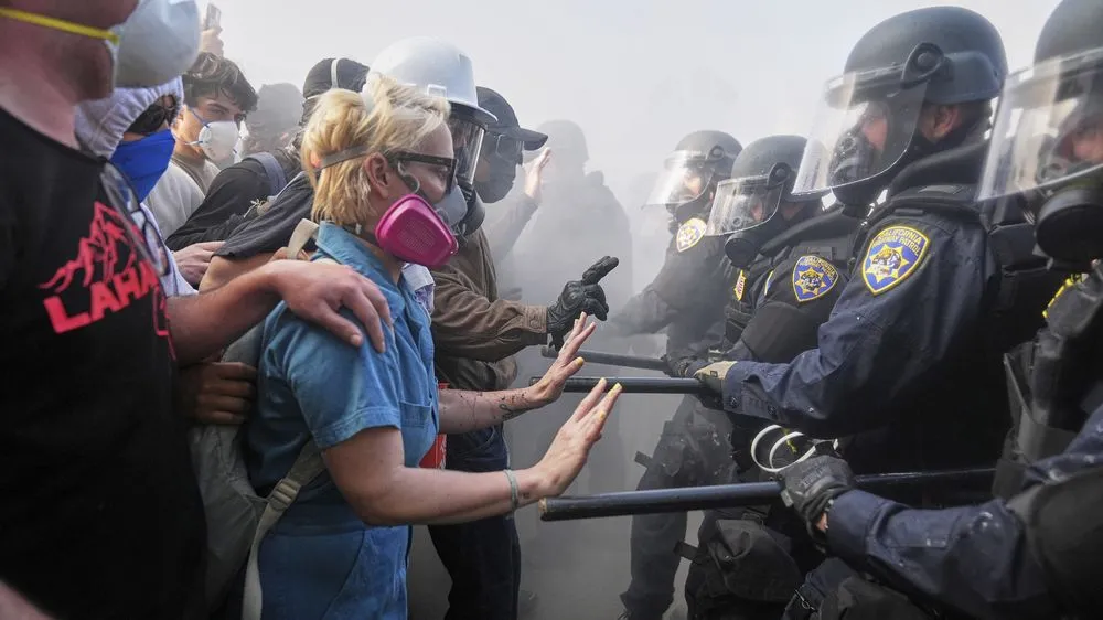 Demonstrators face off with police on the 101 Freeway close to the Metropolitan Detention Centre in downtown Los Angeles.