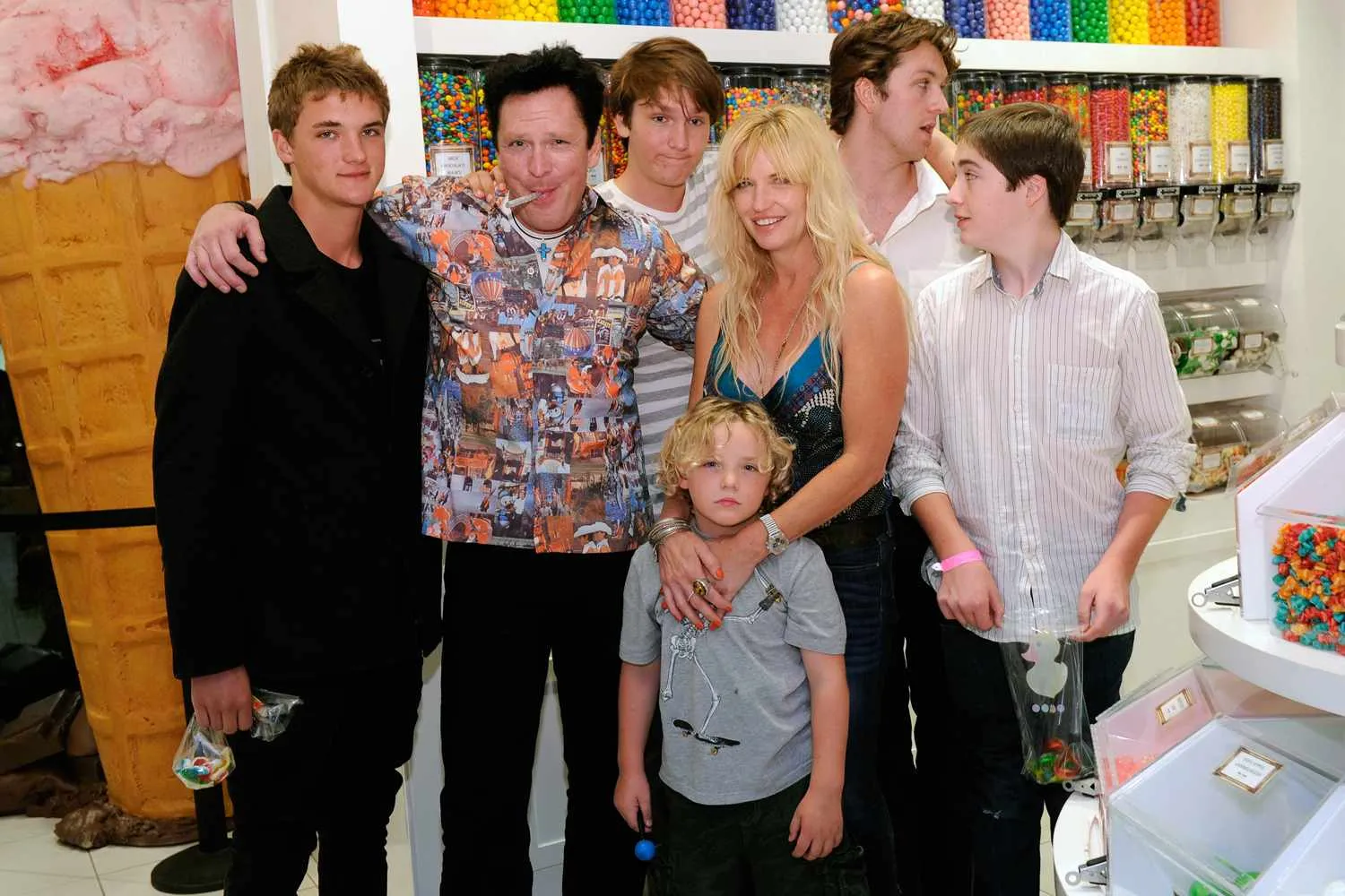 Michael Madsen is pictured with his wife and children at a public event.