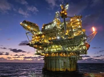 Offshore production concept illustrating the development, extraction, processing, and transportation of oil and gas resources from an offshore field.